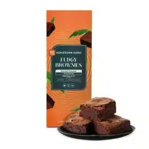 Hometown Hero Fudgy Brownies 200mg 4-pack displayed with rich chocolate brownies on a plate, showcasing hemp-derived Delta-9 THC gourmet edibles.