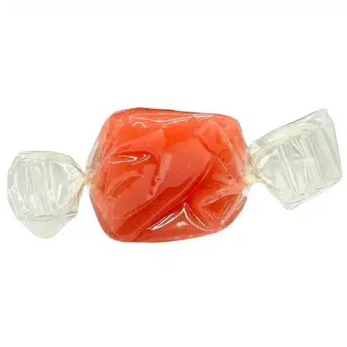 A wrapped strawberry Derived Creations Delta 9 CBD taffy with a vibrant pink color and soft chew texture, delivering a fruity 2:1 edible balance.