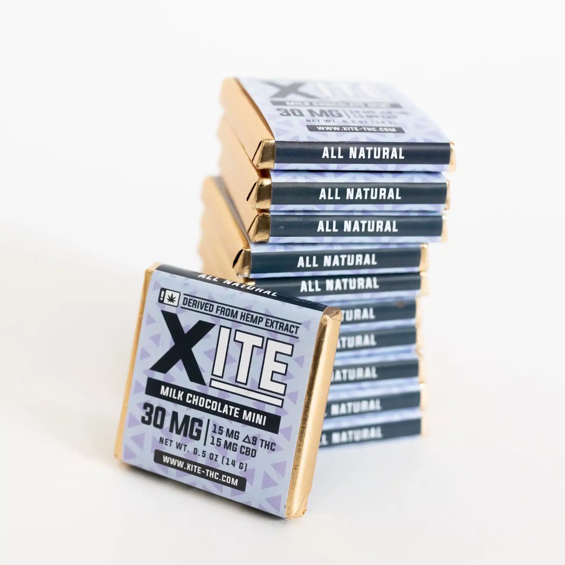 Stack of Xite Delta 9 Milk Chocolate Minis with gold foil wrappers labeled All Natural and 30mg 1:1 CBD THC.