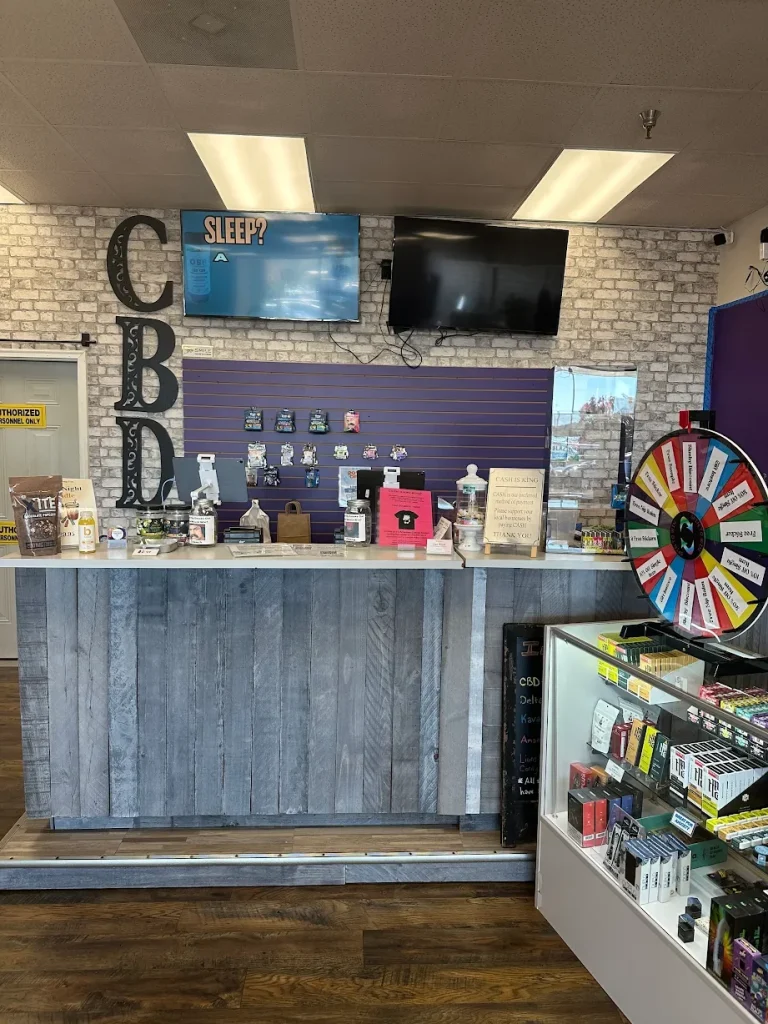 Carolina Hemp Hut Durham checkout counter with display cases and product wheel.