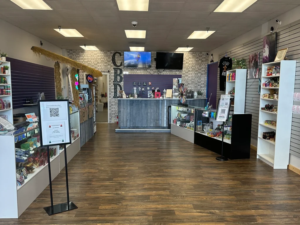 Inside view of Carolina Hemp Hut Durham showing the front counter and display cases.