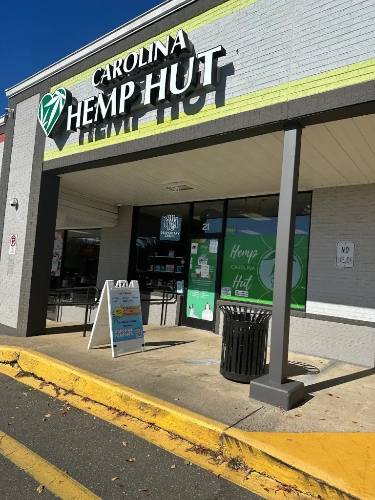 Angled view of Carolina Hemp Hut Durham storefront with outdoor sign and entrance.