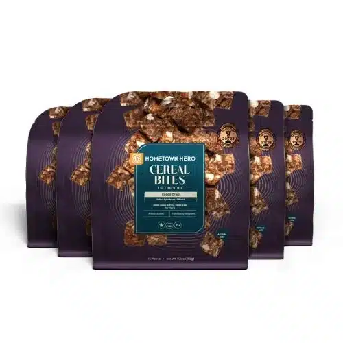Multiple Hometown Hero Cocoa Crisp Cereal Bites stacked together, chocolate cereal edibles infused with a 1:1 THC to CBD ratio